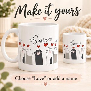 White coffee mugs showing cat paws and hearts with Love or a personalized name